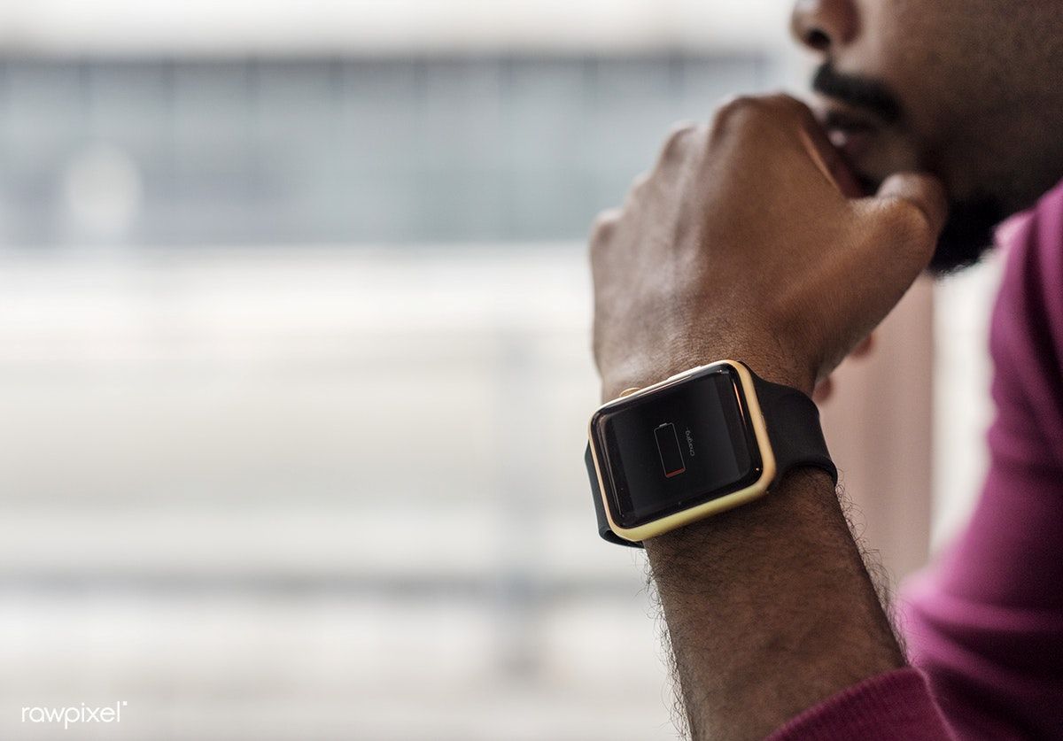 black man wearing smartwatches